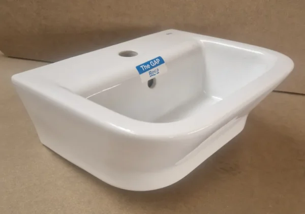 petit lavabo d'angle en céramique blanche