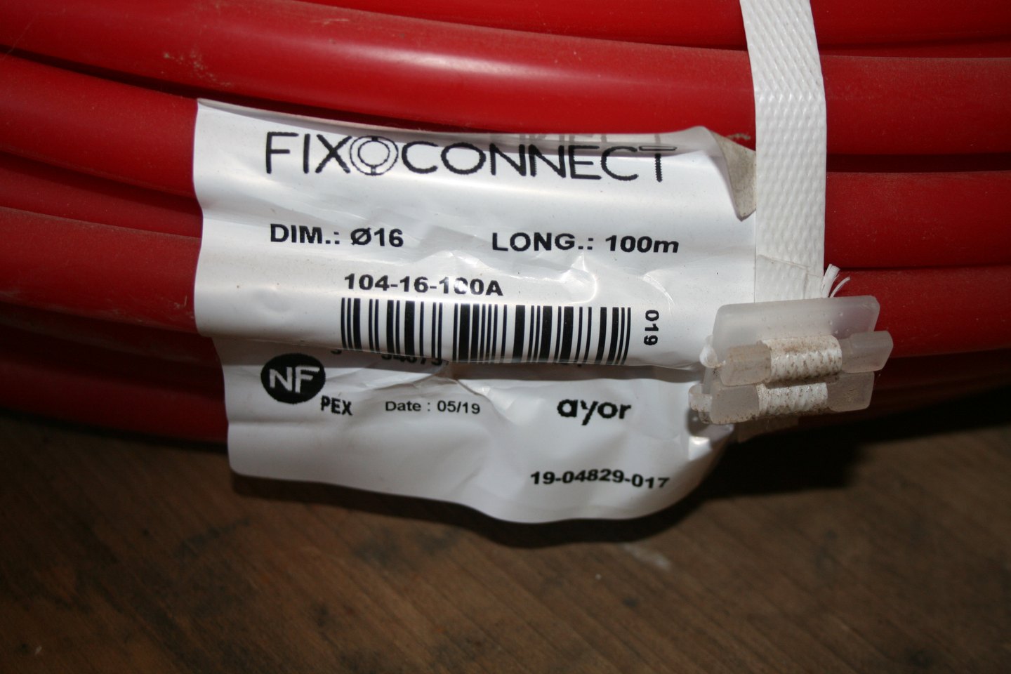 Étiquette FixOConnect Ø16, 100 m, référence 104-16-100A, marquage NF PEX, sur la couronne de tube PER